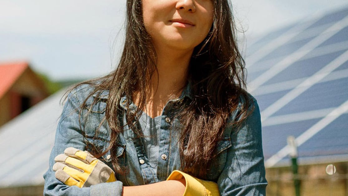 Woman standing in front of solar panels