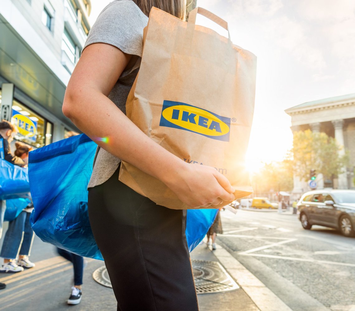 woman holding an IKEA bag.