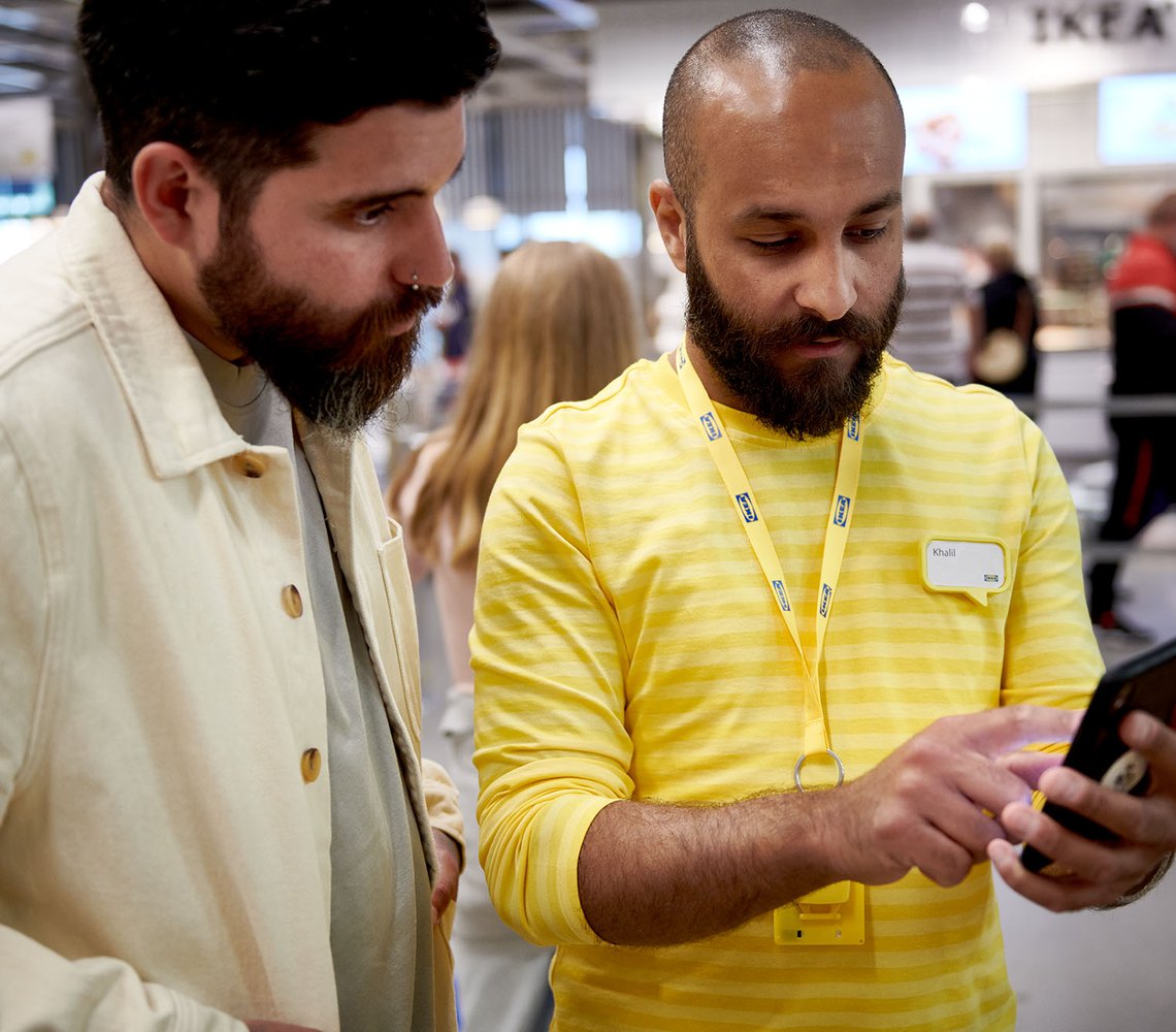 Customer talks to Co-worker inside of IKEA store