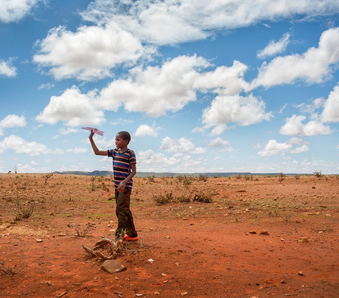 Boy playing on a open field