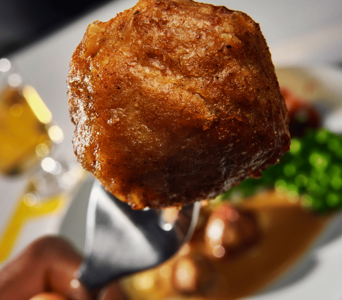 IKEA plant ball on fork - sustainable plant-based meatball alternative.