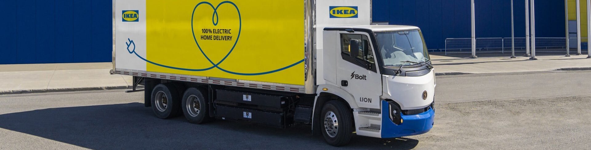 An IKEA truck parked in front of an IKEA store