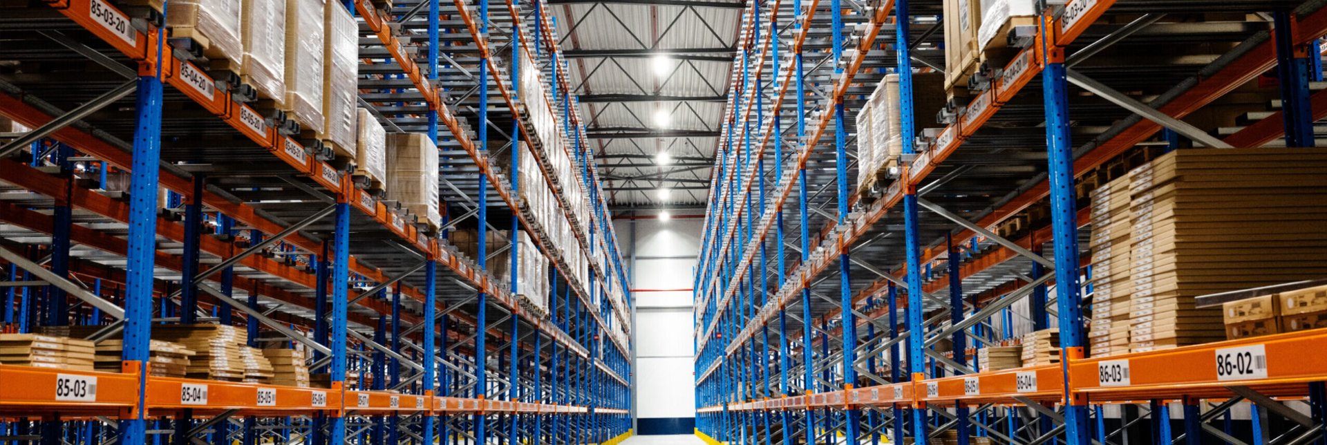 Inside customer distribution centre showing shelves of products