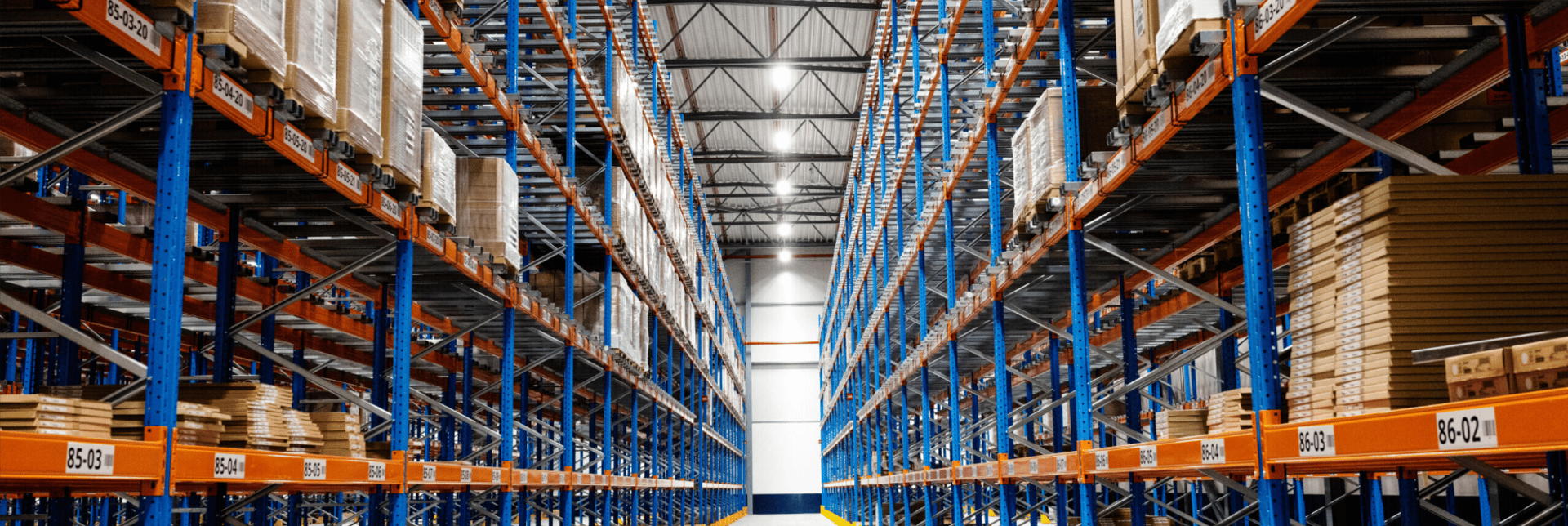 Inside customer distribution centre showing shelves of products