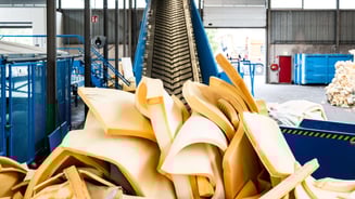 mattresses being recycled through a machine