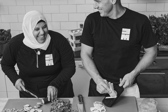 Dawlat Shaimma Abdou and Ola Nilsson in a kitchen