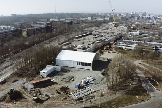 Overall view of a large building in an industrial area