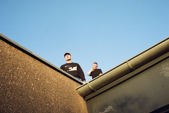 Artists Phlake on the roof of the building