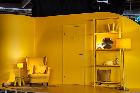 A yellow room with only yellow furniture and interior details