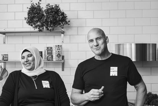 Dawlat Shaimma Abdou and Ola Nilsson in a kitchen