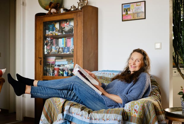 Woman sitting in a sofa