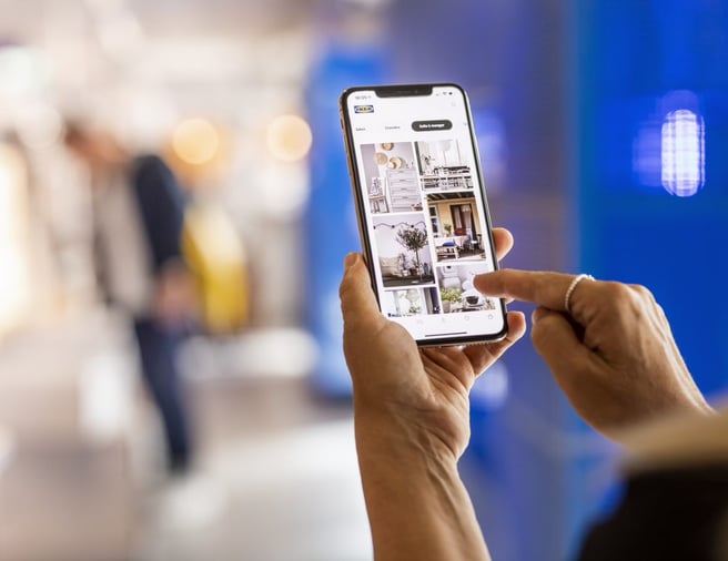 hand holding a mobile phone using the IKEA app