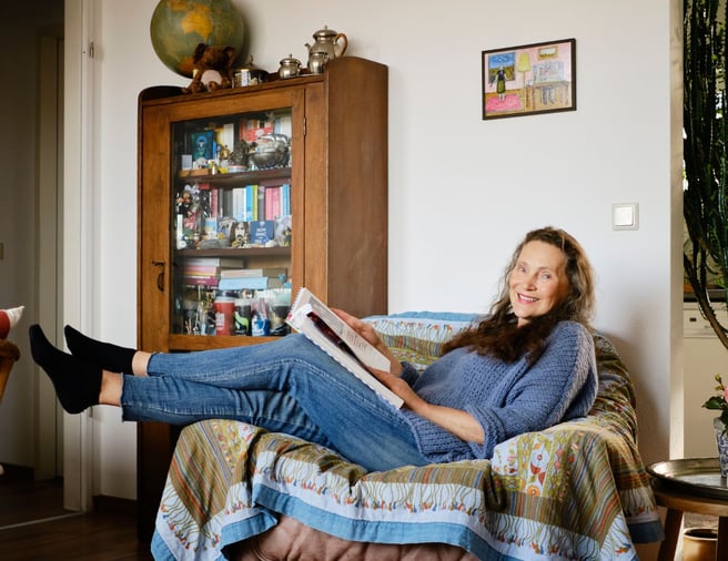 Woman sitting in a sofa
