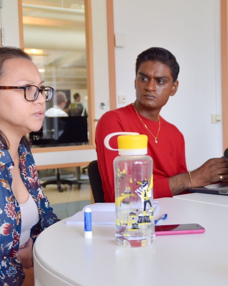 A sitting discussion between Ingka youth leaders inside a meeting room.
