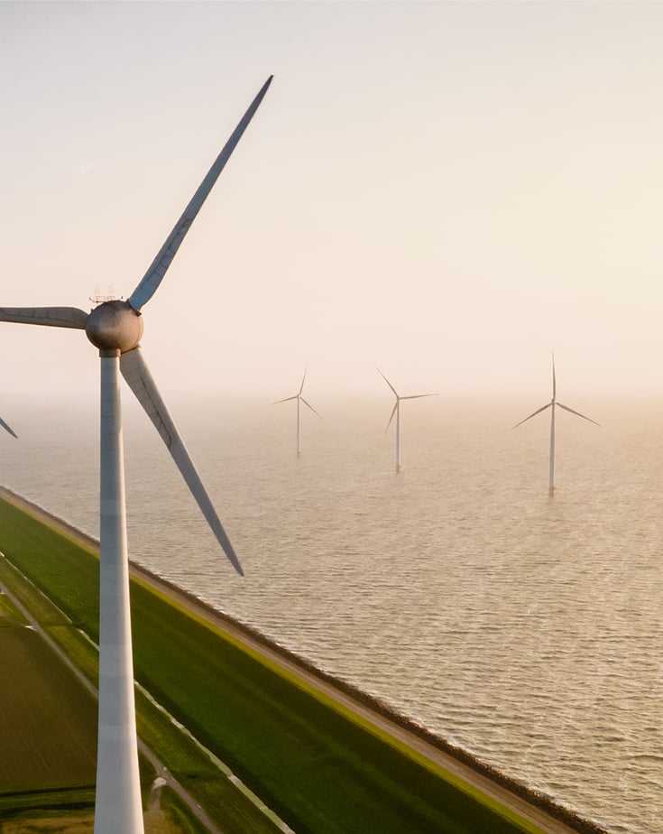 Windmill turbines seen from a drone bird eye view