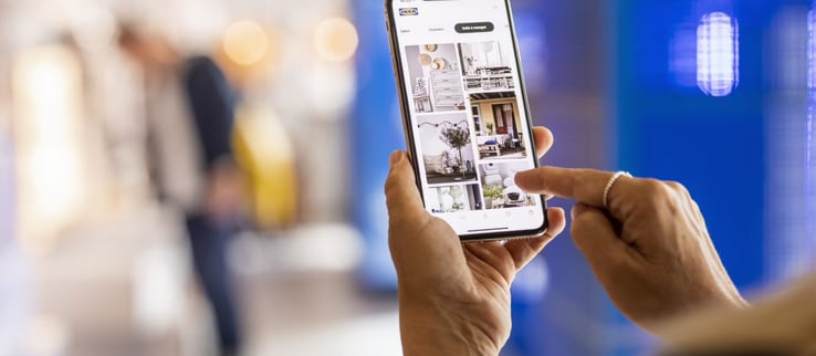 hand holding a mobile phone using the IKEA app