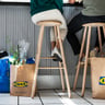 alttext Friends sitting at a cafe with several bags from the IKEA store.