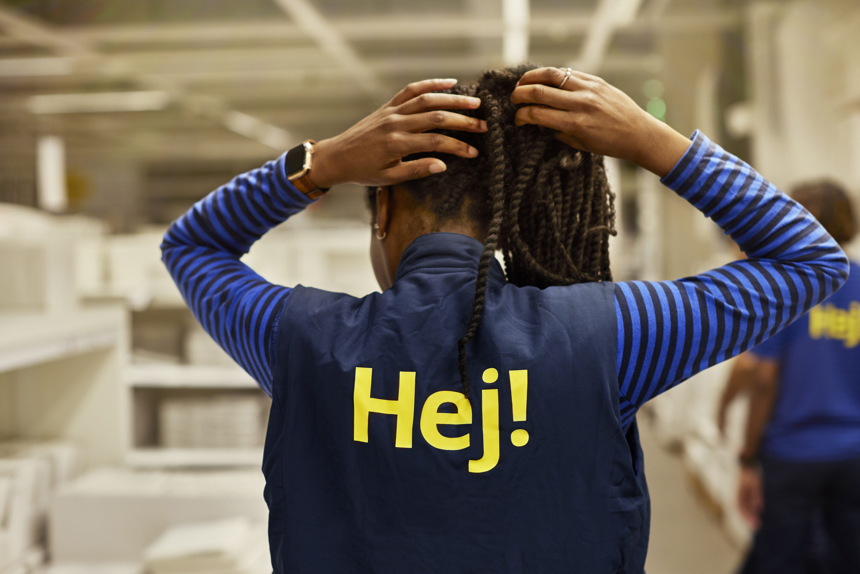 IKEA co-worker with store uniform.